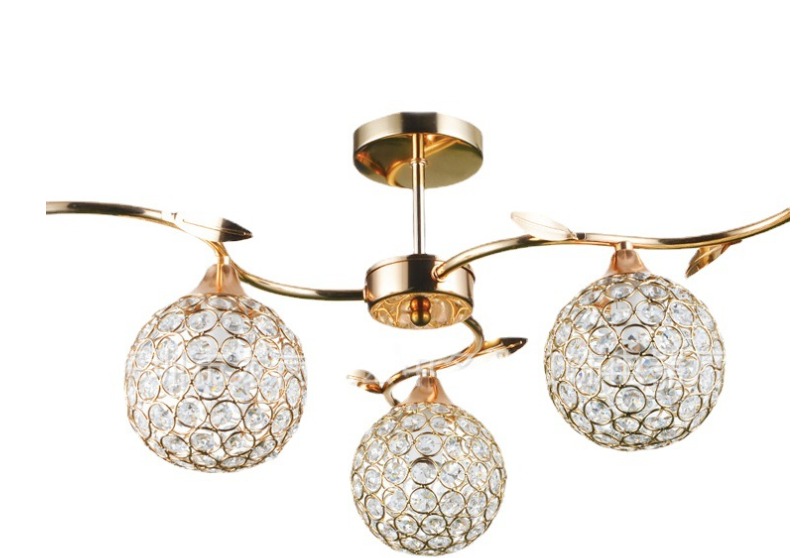 Modern 3-light ceiling lamp with golden metal frame and crystal globe shades, 56x56x29 cm