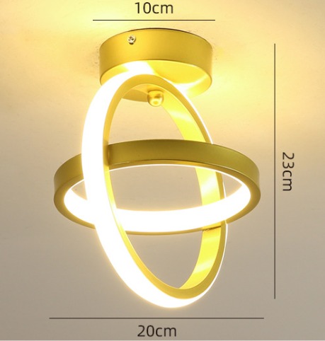 Orbital-style dual ring LED ceiling light in gold with 3D circular design and warm glow