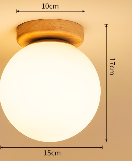 Modern frosted glass globe ceiling light with natural wood base for warm ambient lighting